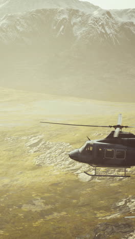 helicopter flying over a mountain range