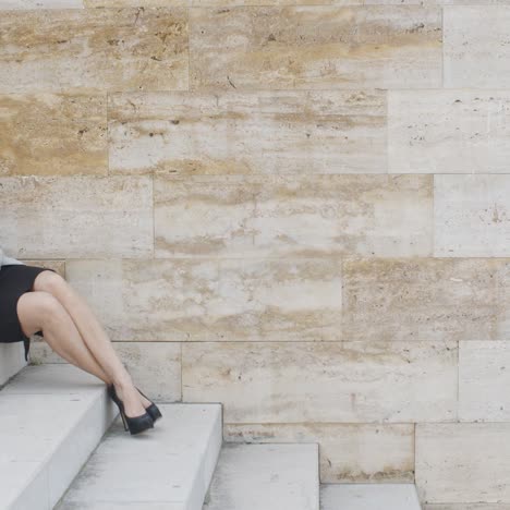 young business woman on stairs drinking coffee