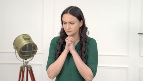 Afraid-Indian-girl-praying-to-god