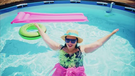 joyful woman enjoying summer fun in swimming pool with colorful floaties and vibrant atmosphere