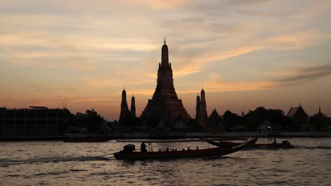 time-lapse of sunset behind wat arun temple