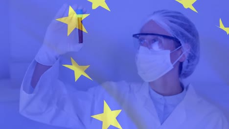 EU-flag-waving-against-female-scientist-wearing-face-mask-holding-test-tube
