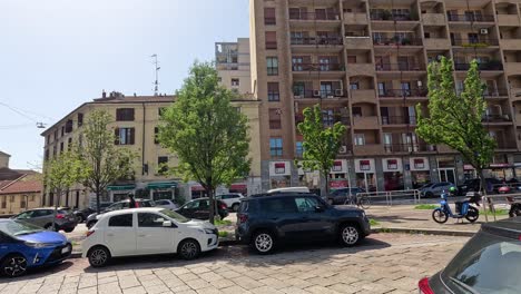 vehicles and pedestrians on a sunny day