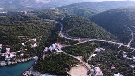 coastal road in montenegro on green forest hill, aerial