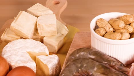 assortment of meats, nuts, and dairy products