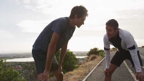 father and young adult son enjoying outdoor activities together