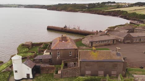 Old-fort-over-rippling-river-under-overcast-sky