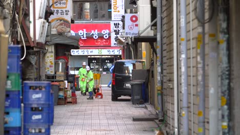 street cleaners working in back street