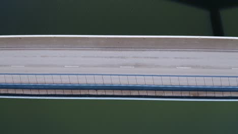 aerial top down view of highway bridge over river