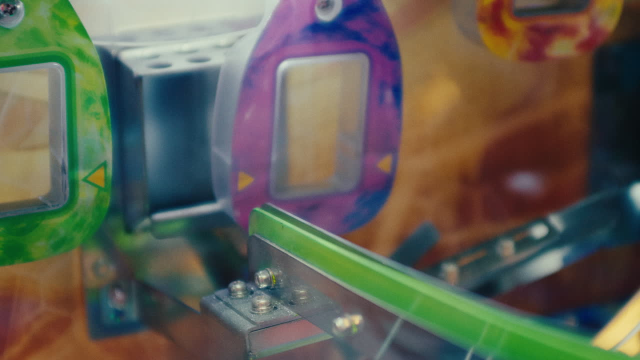 One coin successfully enter the slot while another fail on coin arcade machine in the game area amusement park