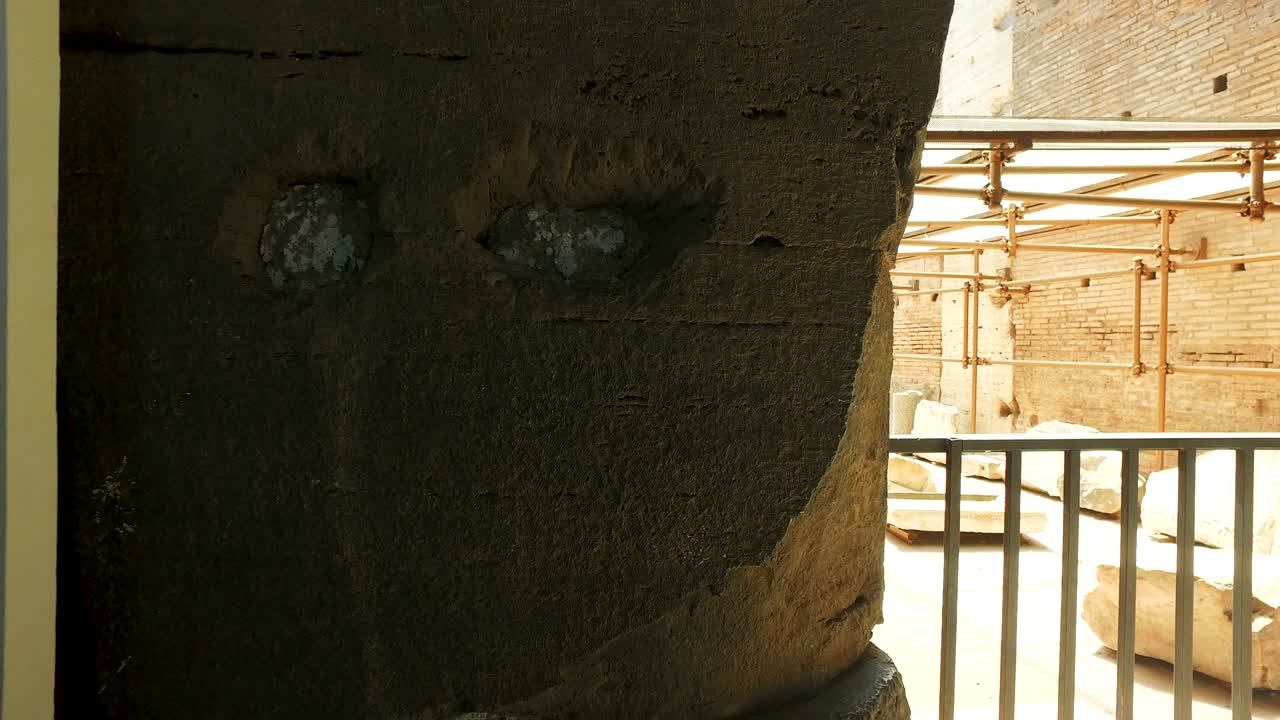 Detail of Colosseum passage with tourist visitors in Rome, cinematic steadicam shot