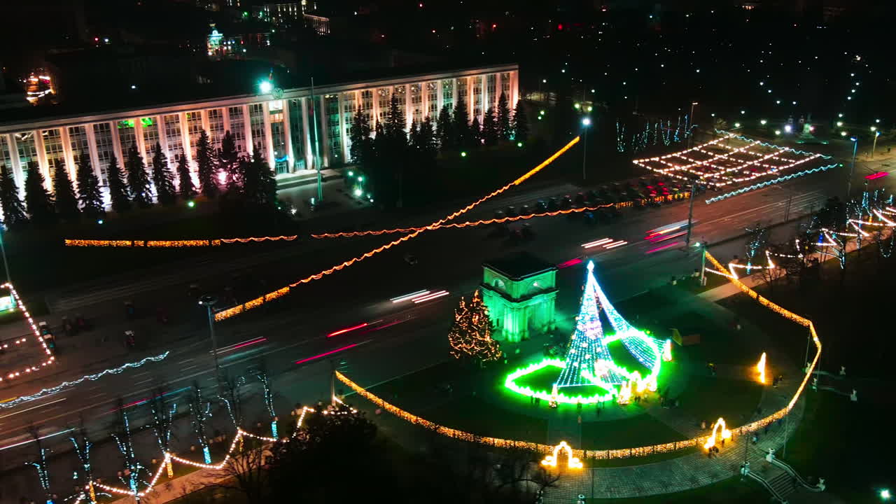 Aerial drone hyperlapse timelapse of Government Building and Triumphal Arch at night. Christmas decorations