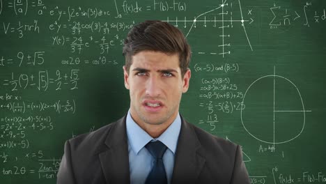 man in front of moving maths on blackboard