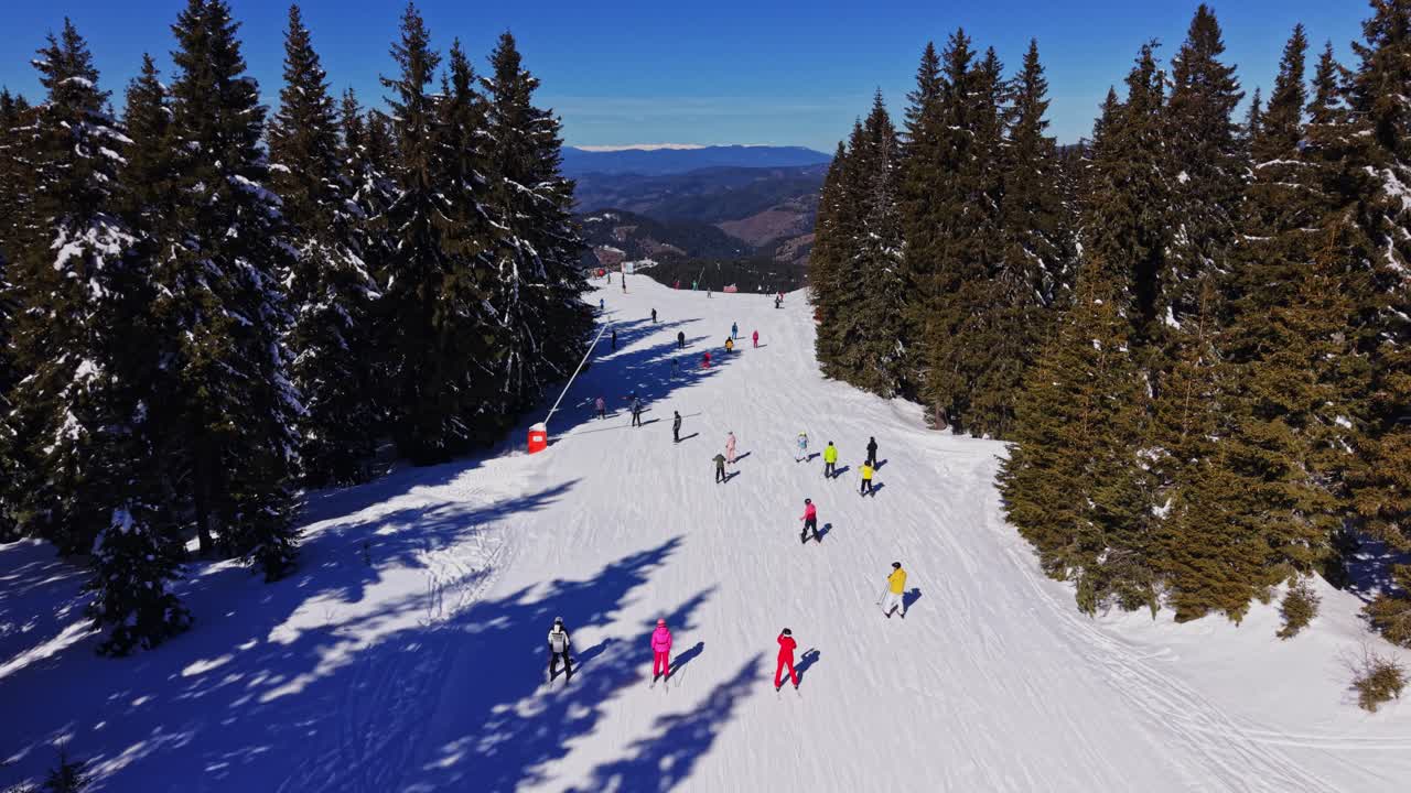 Skiers enjoy snowy slopes in the Carpathians of Bulgaria during winter