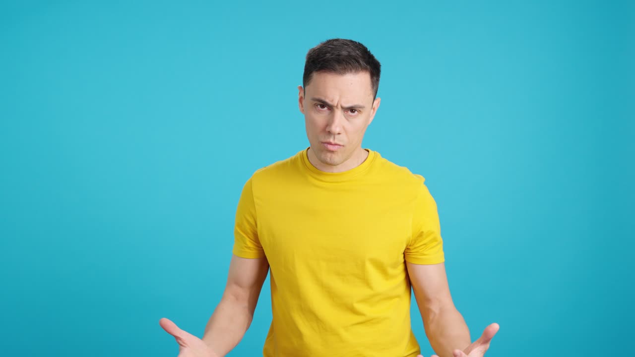 Man in Yellow Shirt on Blue Background