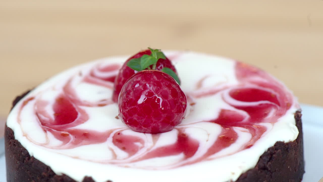 Moving chocolate cake with cherry on top