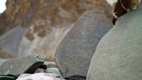 carved stones on the mountains with ancient drawings, scripts