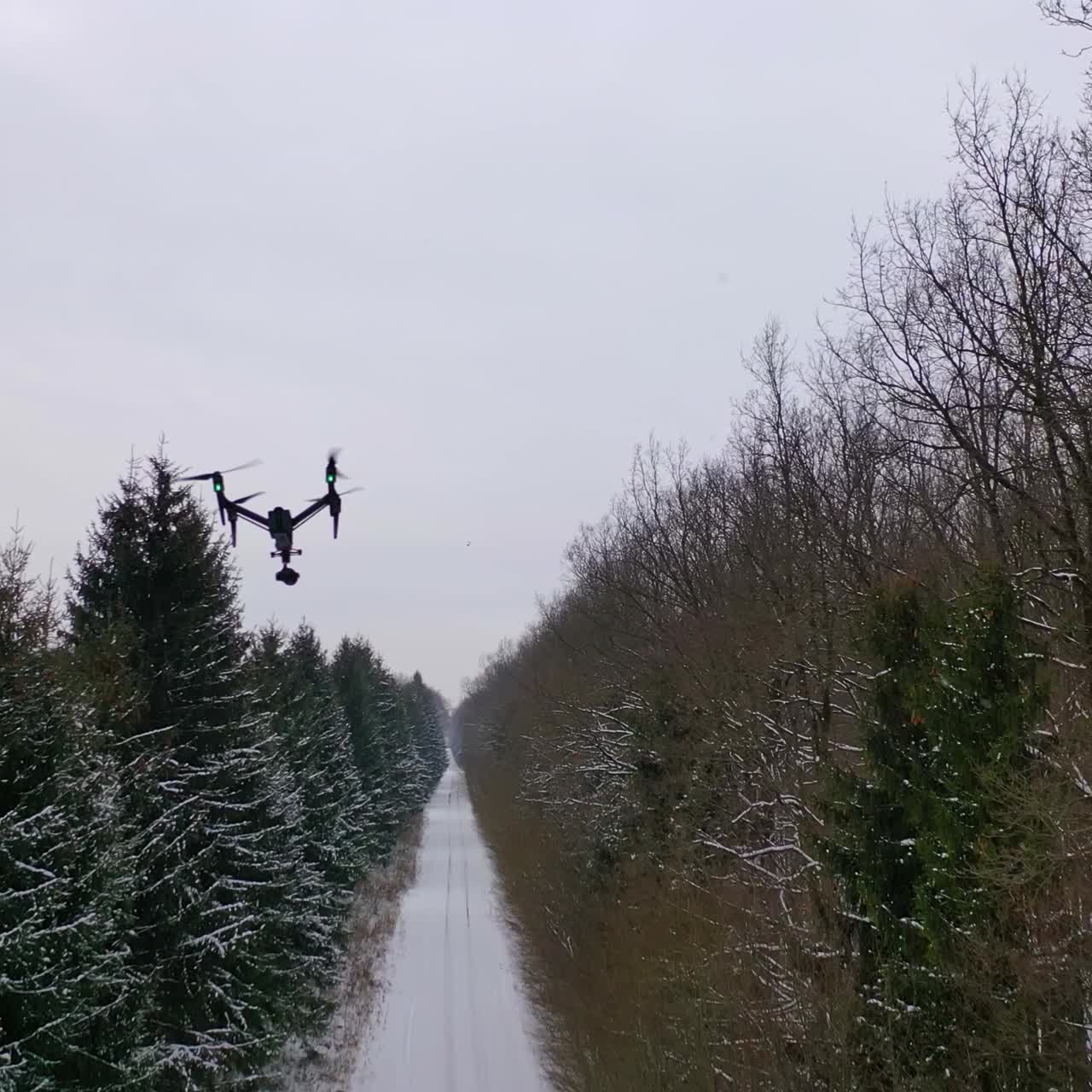 Drone with camera flying high above