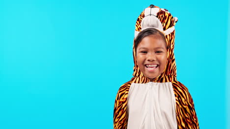 tiger costume, funny and face of girl in studio