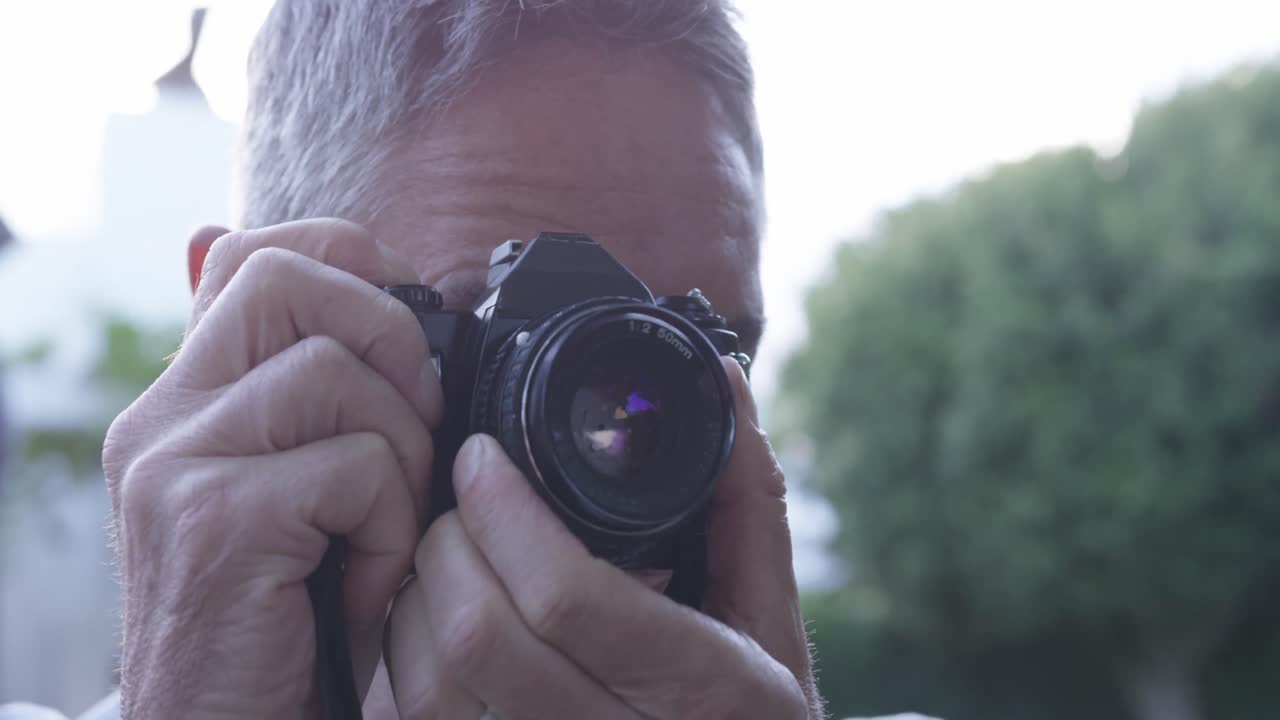 Premium stock video - Man using a camera