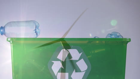 animación de un cartel de reciclaje verde sobre una caja con botellas de plástico y una turbina eólica