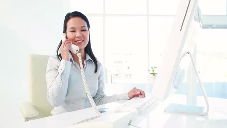 Asian-businesswoman-on-the-phone