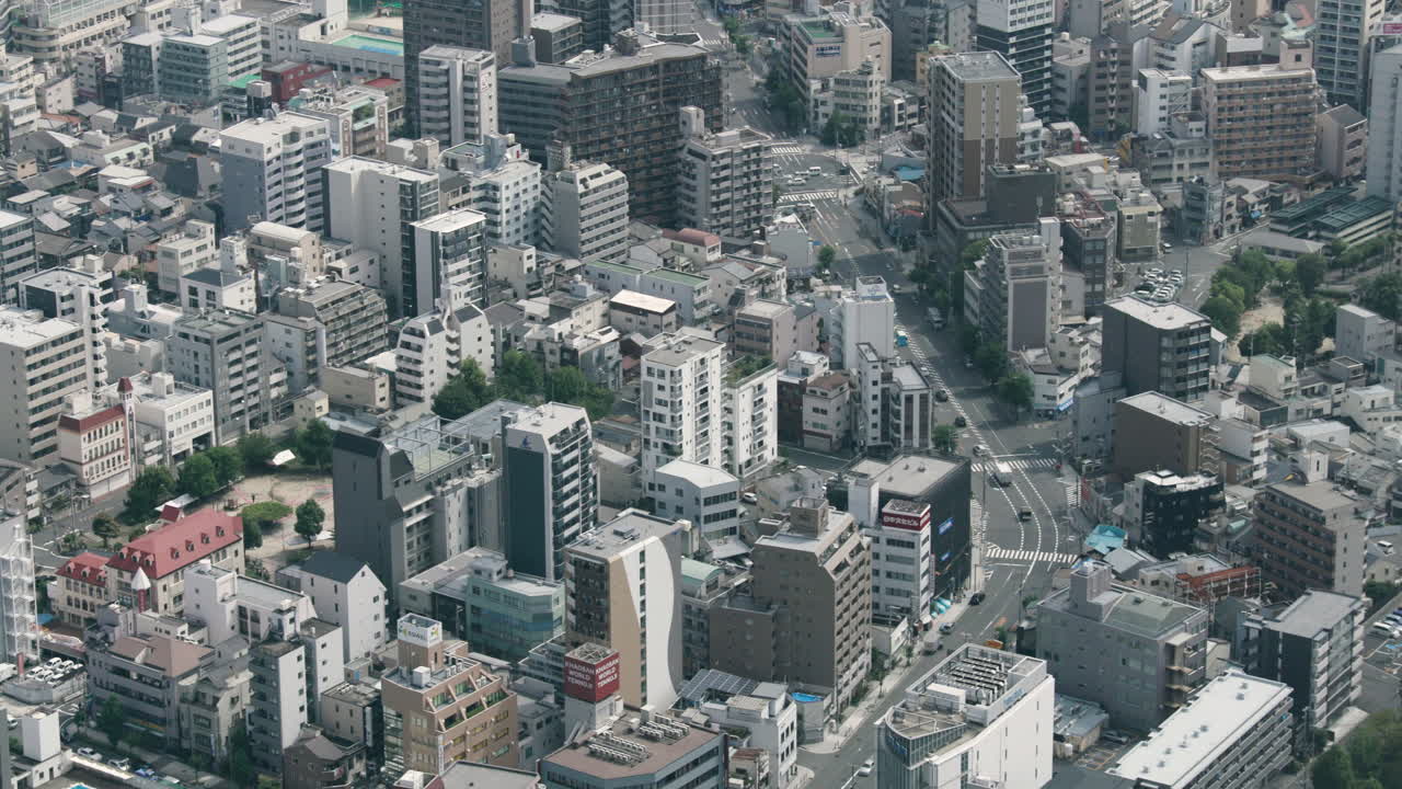 View of Osaka City from a skyscraper. The busy city of Osaka in Japan filled with buildings and busy streets