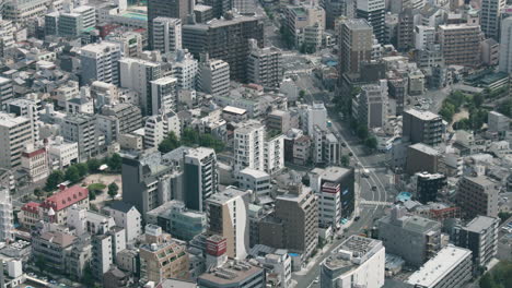 view of osaka city from a skyscraper. the busy city of osaka in japan filled with buildings and busy streets