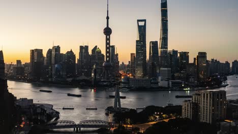 aerial view of city skyline and modern buildings in shanghai at sunrise