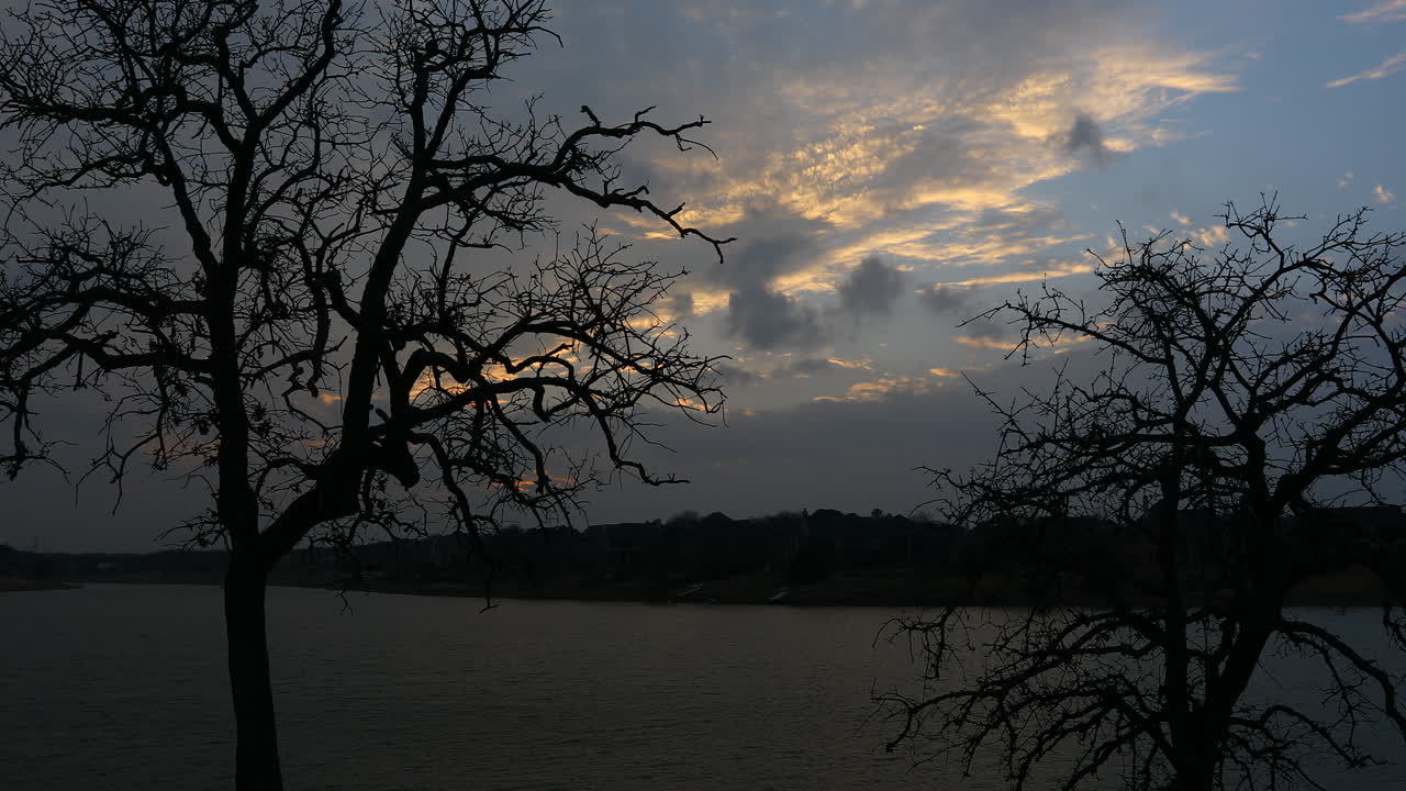 This is a video of a colorful sunset over Lake Lewisville in Texas