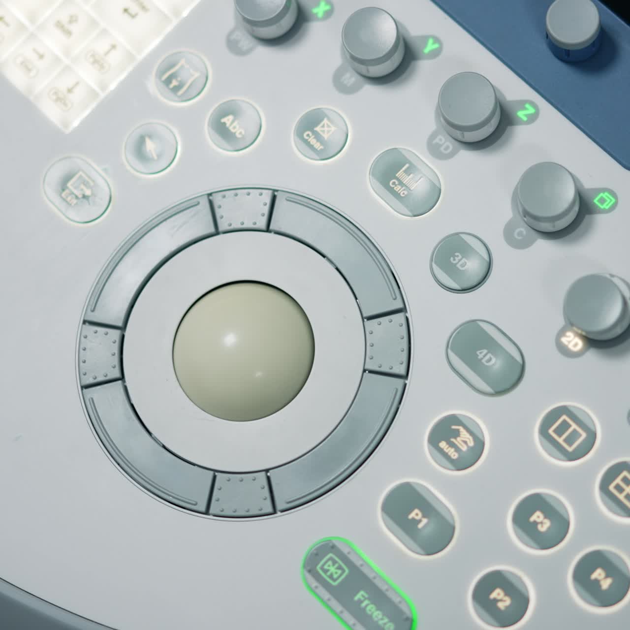Diverse buttons and keys on the medical apparatus. Close up. Sensor keyboard on the sonography diagnostic equipment from top