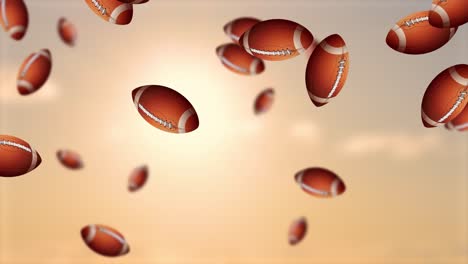 footballs falling from the sky at sunset