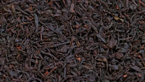 looped spinning dry black tea full frame close-up background