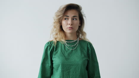 woman in green polka dot shirt