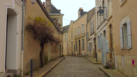 scene of an empty cobbled street in the old village in angers, france