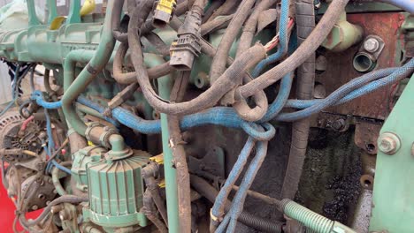 the wiring loom on the side of an engine from an underground mining loader