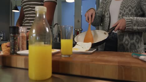 Happy-couple-cooking-together-in-the-kitchen