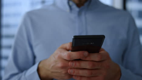 Businessman-using-mobile-phone