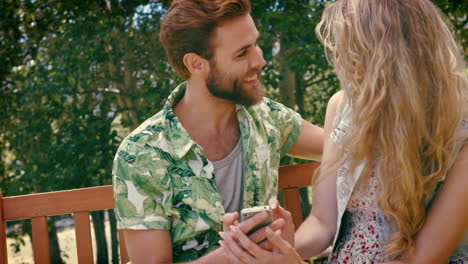 In-high-quality-format-young-couple-relaxing-on-park-bench-