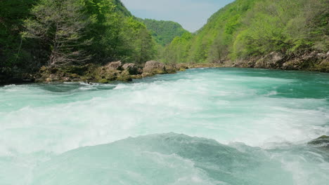 A-waterfall-of-a-pure-wild-river-located-in-a-green-rainforest