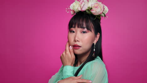 woman in floral crown and teal dress