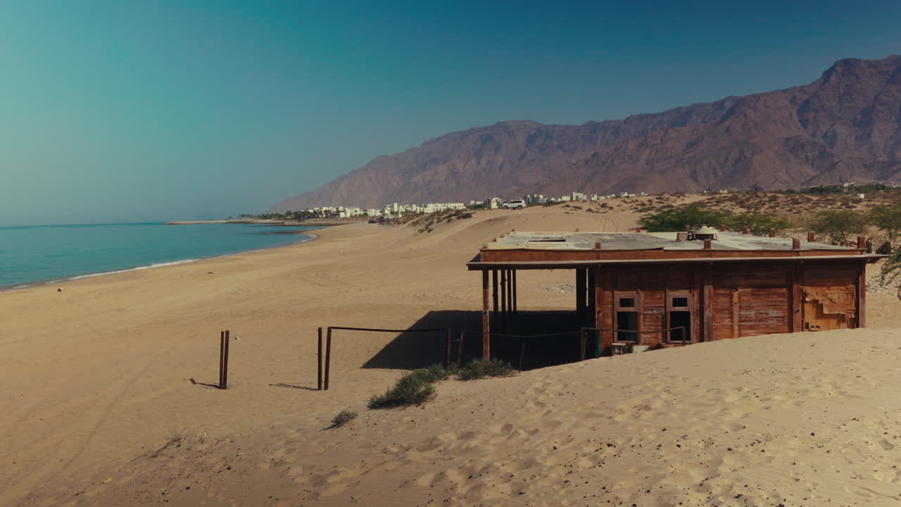 Abandoned Wooden Hut on a Deserted Beach