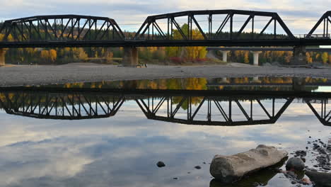 reflective quietude: cnr bridge over calm waters in prince george