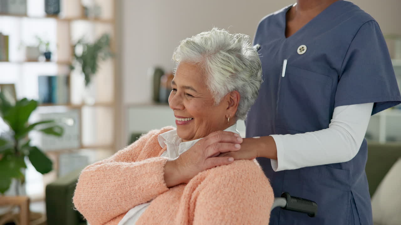 Elderly woman in wheelchair with caregiver