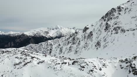 hiking along snowcapped peaks in the tatras mountains in morskie oko park in zakopane poland