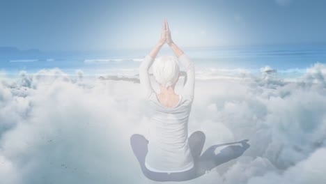 animation of glowing light over senior woman practicing yoga by seaside