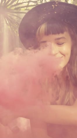 young joy relaxed caucasian woman traveler waves smoke bomb located in jungle