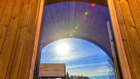 passage of daytime sunlight facade of wood cabin cottage