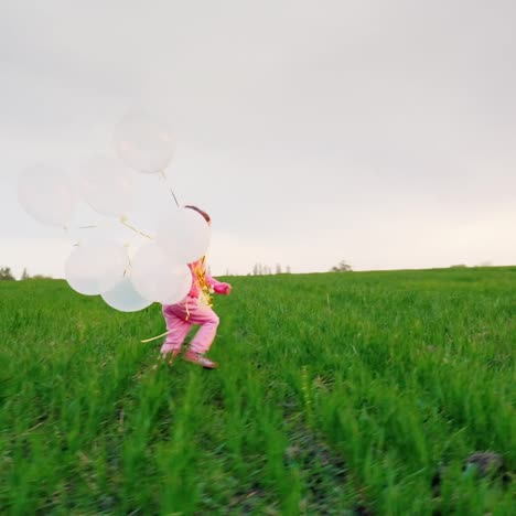 little girl in pink clothes with balloons 2