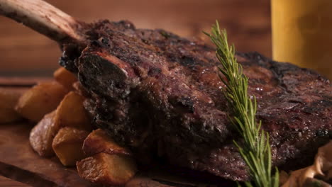 Massive-Tomahawk-strip-steak-over-roasted-potatoes-and-wild-mushrooms-on-wooden-carving-board,-slider-HD